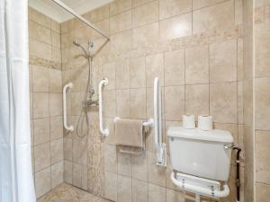 a bathroom with a shower and a toilet at Blackberry - 19263 in Horsford