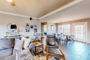 a living room with a couch and a table at The Brick Beauty on Cabriolet in Bentonville