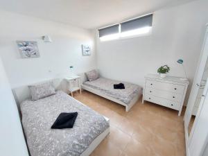 Łóżko lub łóżka w pokoju w obiekcie Casa DamiAnna - Pool - WiFi - FuerteventuraBay