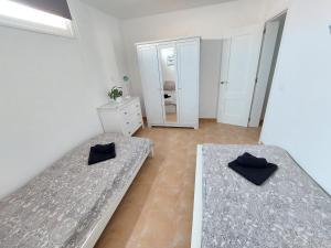 Łóżko lub łóżka w pokoju w obiekcie Casa DamiAnna - Pool - WiFi - FuerteventuraBay