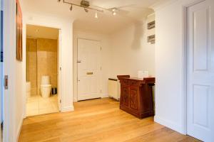 a bathroom with a sink and a toilet in a room at Statera Apartments - Thames View in London