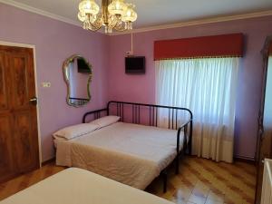 a bedroom with a bed and a mirror at Casa Da Vieira in Ourense
