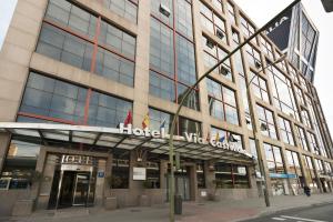 a building with a sign on the front of it at Crisol Vía Castellana in Madrid