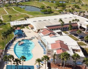 an aerial view of a resort with a swimming pool at Copper Bottomed Waterfront Cottage Bring the family Please see Manager Info before booking in Port Isabel