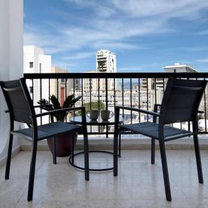a table and chairs on a balcony with a view at Urban Condo 12 - 2 Bdr in Nicosia