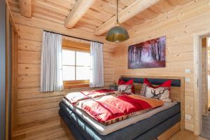 Rúm í herbergi á Biochalet Haus 1