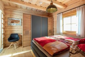 Rúm í herbergi á Biochalet Haus 1