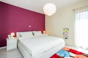 Cama o camas de una habitación en Cozy and Modern Apartments
