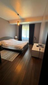 En eller flere senge i et værelse på Apartament DoDe Predeal