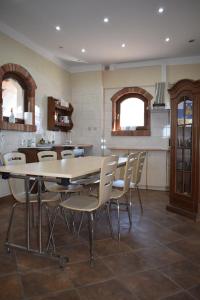 a dining room with a table and chairs at Domek 1 w Rancho Żnin in Żnin
