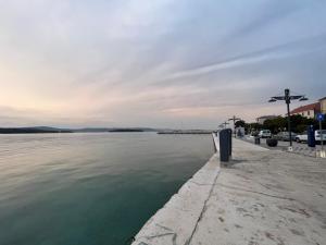 a view of a body of water with a pier at Apartment Aron in Biograd na Moru