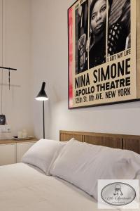 Łóżko lub łóżka w pokoju w obiekcie La Linda Little Apartments
