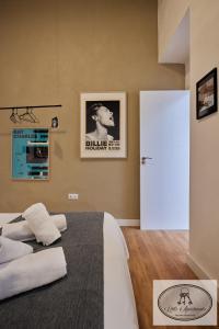 Łóżko lub łóżka w pokoju w obiekcie La Linda Little Apartments