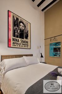 Łóżko lub łóżka w pokoju w obiekcie La Linda Little Apartments