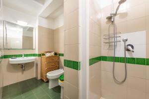 a bathroom with a shower and a sink and a toilet at Casa Buenavista Villasimius in Villasimius