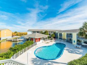 an image of a swimming pool on a balcony of a house at Villas on the Gulf unit C5 in Pensacola Beach