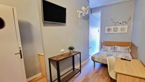 Posteľ alebo postele v izbe v ubytovaní Paraiso Hostel