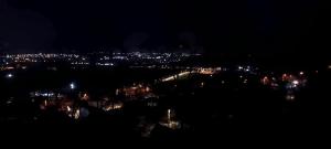 a view of a city at night with lights at Casă particulară in Suceava