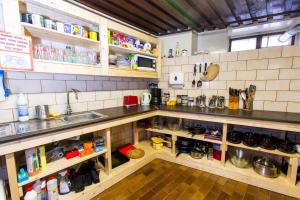 a kitchen with a sink and a counter top at Old Town Hostel Alur in Tallinn +25 photos
