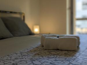 A bed or beds in a room at Verona Holidays DOC