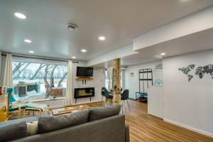 a living room with a couch and a table at The Ox + Bow in Portage La Prairie