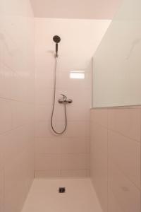 a bathroom with a shower with a shower head at Kings House in Almería