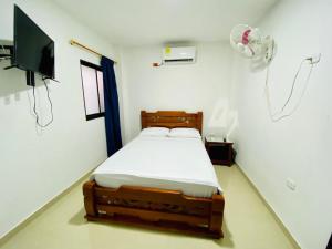 Ένα ή περισσότερα κρεβάτια σε δωμάτιο στο Hotel Villa Paraguay