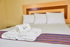 Samkauta Hotel & Suite客房内的一张或多张床位