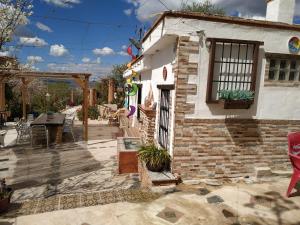 a house with a patio outside of it at Loma Negra in Dúrcal