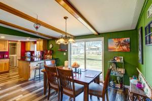 a kitchen and dining room with a table and chairs at Port Clinton House with Boat Dock on Portage River! in Port Clinton