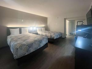 Кровать или кровати в номере Motel 6 Glendale Phoenix