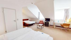 Postel nebo postele na pokoji v ubytování GHOTEL hotel & living Kiel