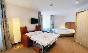 Postel nebo postele na pokoji v ubytování GHOTEL hotel & living Kiel