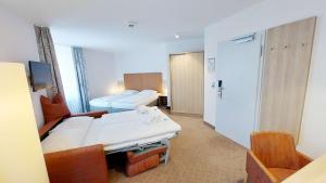 Postel nebo postele na pokoji v ubytování GHOTEL hotel & living Kiel