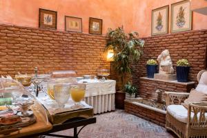 a room with a table with drinks on it at As Janelas Verdes Inn - Lisbon Heritage Collection - Riverside in Lisbon