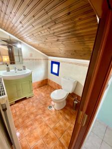 a bathroom with a toilet and a sink at Fourka House in Kassandra +37 photos