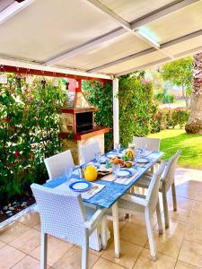 a blue table and chairs on a patio at Fourka House in Kassandra