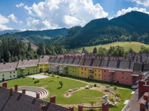 an aerial view of a village with buildings and a field at Apartment Seemauer am Erzberg in Eisenerz