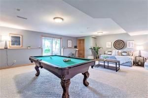 a living room with a pool table in it at Pet-Friendly Mosinee Retreat w/ Private Dock! in Mosinee