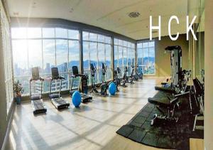 a gym with a bunch of tread machines in a building at Titiwangsa Core at TR Residence by HCK in Kuala Lumpur