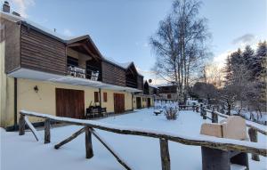 a house with snow on the ground in front of it at 2 Bedroom Awesome Home In Careggine in Careggine