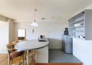 Η κουζίνα ή μικρή κουζίνα στο Katsuura Hilltop Hotel & Residence