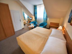 Rúm í herbergi á EA Hotel Tosca