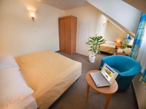 Rúm í herbergi á EA Hotel Tosca