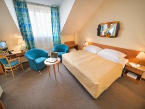 Postel nebo postele na pokoji v ubytování EA Hotel Tosca