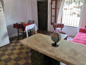 a living room with a table and a dining room at Doña Isabel 2 in Gualeguay