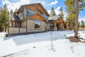 a house in the woods in the snow at Dancing Rock "Grandview Lodge" (Caldera Springs) in Sunriver