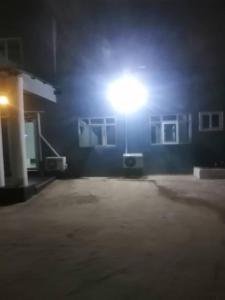 a street light in front of a building at night at Danson Lodge Guest House in Pokuase