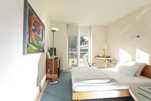 Postel nebo postele na pokoji v ubytování Hotel Watthalden