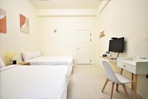 文旅行民宿-莊園館-寵物友善客房内的一张或多张床位